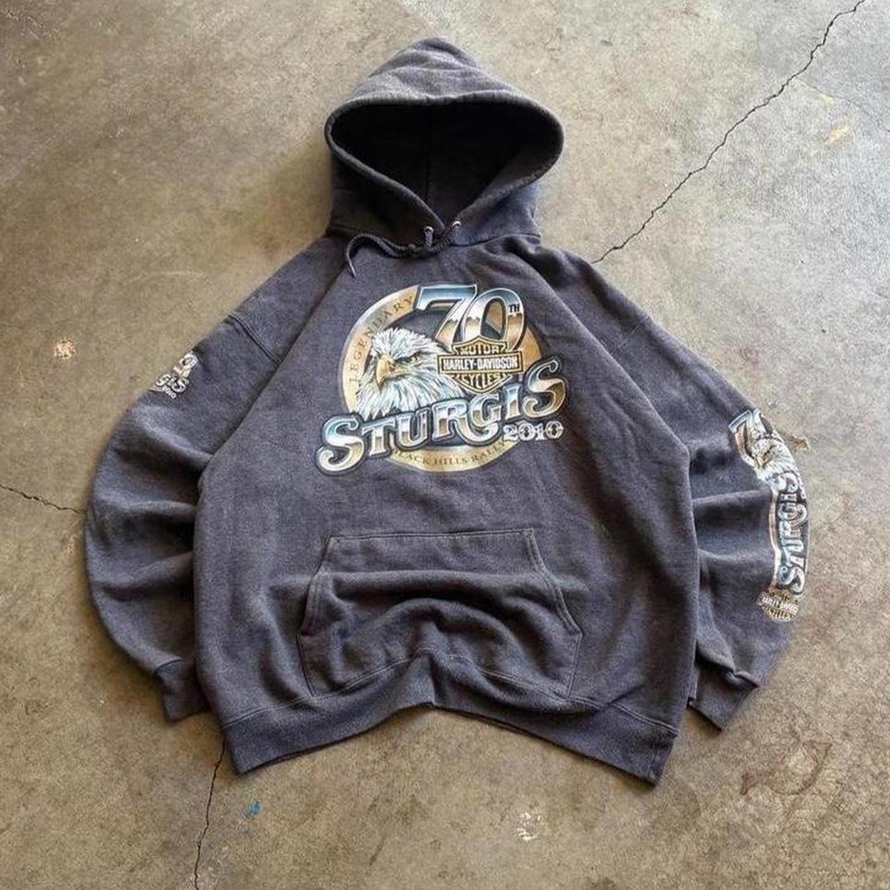Dark Harley-Davidson Sturgis hoodie laid on concrete